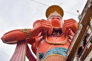 Big statue of Lord Hanuman near the delhi metro bridge situated near Karol Bagh, Delhi, India, Lord Hanuman big statue touching sky photo