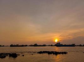 Beautiful golden orange sunset over the ocean. Free stock photo. photo