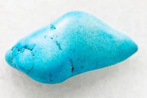 tumbled Turquenite blue howlite gem on white photo