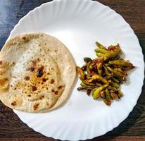 Indian Vegetable parwal Curry and Chapati  Homemade chapati Indian bread served with Indian parwal curry. photo