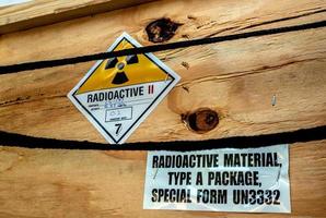 Radiation label beside the transport wooden box Type A package photo