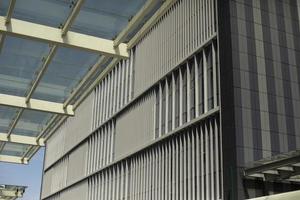 Building is outside. Windows in building. Vertical lines in architecture. photo