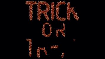 3d animated halloween lantern particle typeface forming the word Trick Or Treat video