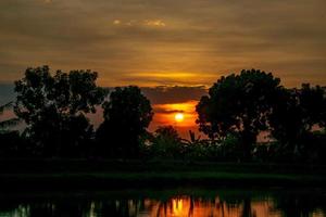 beautiful sunset over the field photo