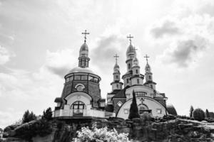 Christian church cross in high steeple tower for prayer photo