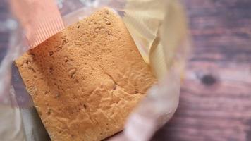 Overhead view of baked bread in plastic in bakery packaging video
