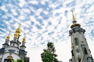 Christian church cross in high steeple tower for prayer photo