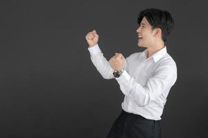 Business man wearing white shirt making gestures. photo