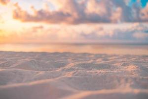 Closeup sea sand beach. Panoramic beach landscape. Blurred tropical beach seascape horizon. Orange and golden sunset sky calmness tranquil relaxing sunlight summer mood. Vacation travel holiday banner photo