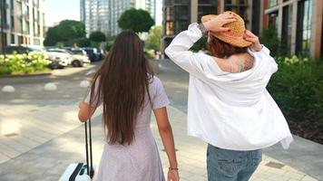 Two women explore city together on a sunny day video