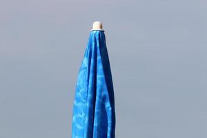 Umbrella in the city park near the sea. photo