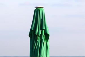 Umbrella in the city park near the sea. photo