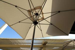 Umbrella in the city park near the sea. photo