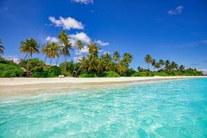 Best summer beach landscape. Tranquil tropical island, paradise coast, sea lagoon, horizon, palm trees and sunny sky over sand waves. Amazing vacation landscape background. Beautiful holiday beach photo