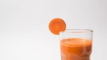 Carrot juice on white background , healthy eating concept photo