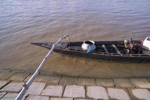 Beautiful Landscape View of wooden fishing boats on the bank of the Padma river in Bangladesh photo