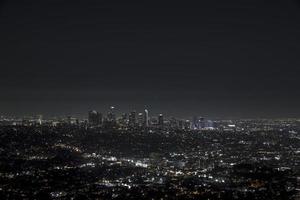 Beautiful night view of Los Angeles downtown in California from above. 4k video. Busy night city aerial view. photo