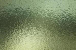 textura de hoja de vidrio esmerilado verde con arañazos, fondo de textura abstracta foto