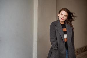 Outdoor fashion portrait of  beautiful fashionable girl   posing in street,  Copy, empty space photo