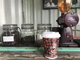 Semarang,Indonesia,2022-coffee cup and jar of coffee beans and tools for making coffee photo