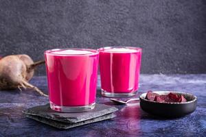 Vegetable beetroot latte in glasses on the table. Coffee alternative. photo