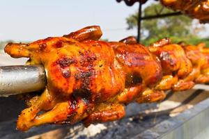 Chicken roasted on the spit photo