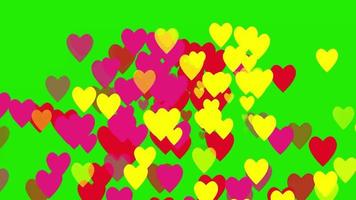 yellow, red and pink heart symbols falling like raindrops on a green screen video