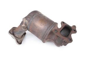 Damaged Catalytic of car in exhaust system on white background photo