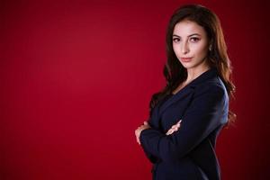 Business woman posing over red background photo