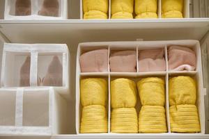 there are clean towels on the shelf in the closet photo