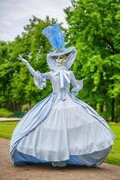 masquerade ball, a woman in a beautiful dress and Venetian mask photo