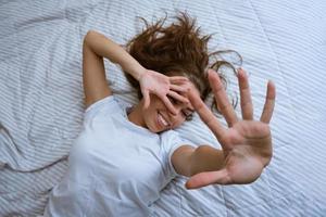 Lazy morning concept. Beautiful happy woman photo