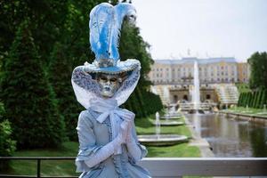 Woman in carnival dress mask photo