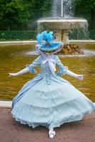 Woman in a Venetian mask and a beautiful carnival dress photo