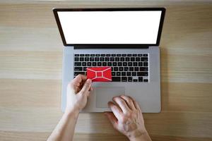 male hands behind laptop with credit card photo