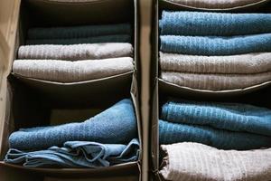 there are clean towels on the shelf in the closet photo