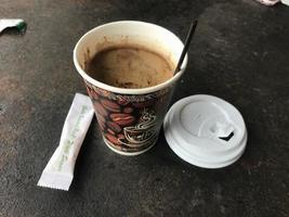 Semarang,Indonesia,2022-coffee cup on an old and rusty iron table photo