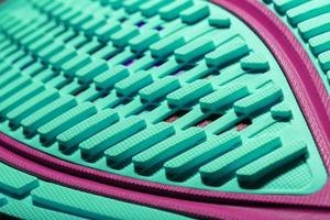 Turquoise outsole tread with sports sneakers for jogging and fitness. Sports style, close-up photo