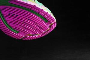 Pink sole tread with sports sneakers for jogging and fitness. photo
