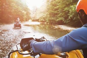 Ride an ATV in the first person off-road. photo