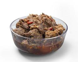 Traditional Beef Curry Served in transparent bowl front view on white Background photo