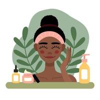 ilustración plana mujer afroamericana con toalla en la cabeza cuida la piel. vector