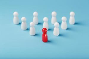 The leader in red leads a group of white employees to victory, HR, Staff recruitment. The concept of leadership. photo