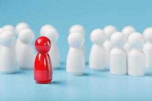 The leader in red leads a group of white employees to victory, HR, Staff recruitment. The concept of leadership. photo