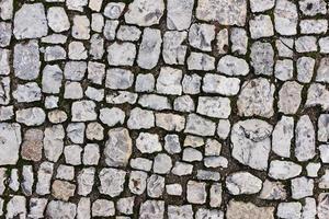 Stone pavers of gray stones near the old castle. photo