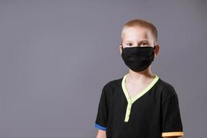 portrait of a guy in a black protective mask on the background photo