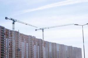 high-rise buildings under construction with photo