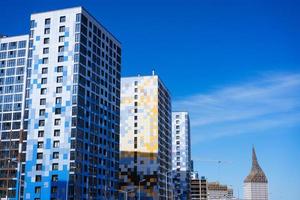 facades of high-rise buildings against a blue sky photo