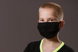 portrait of a guy in a black protective mask on the background photo