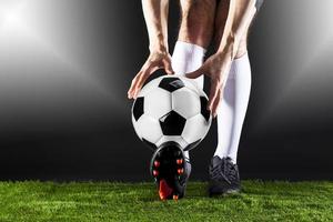 Football. Soccer. Soccer player dribbling with ball photo